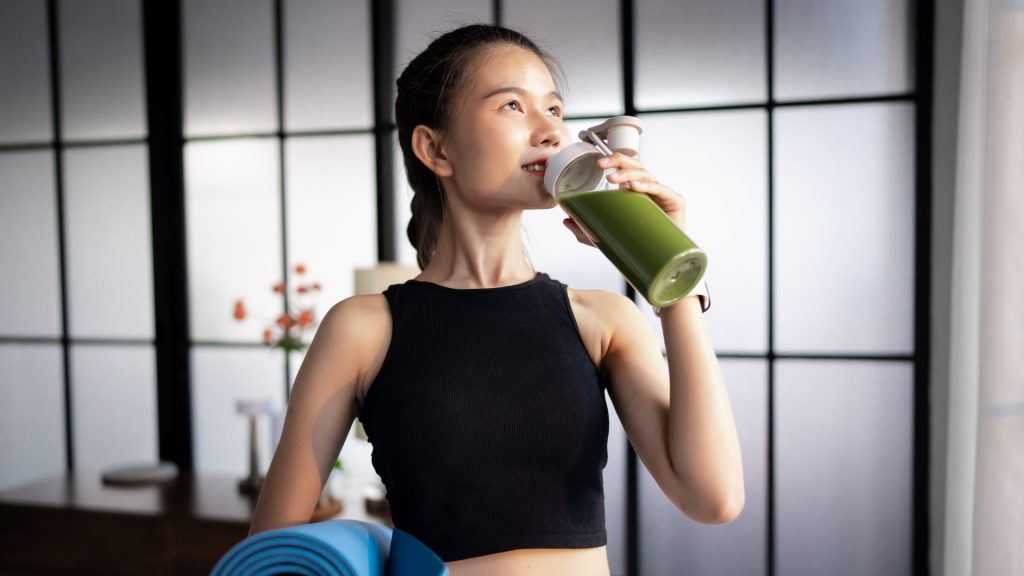 A woman drinking protein