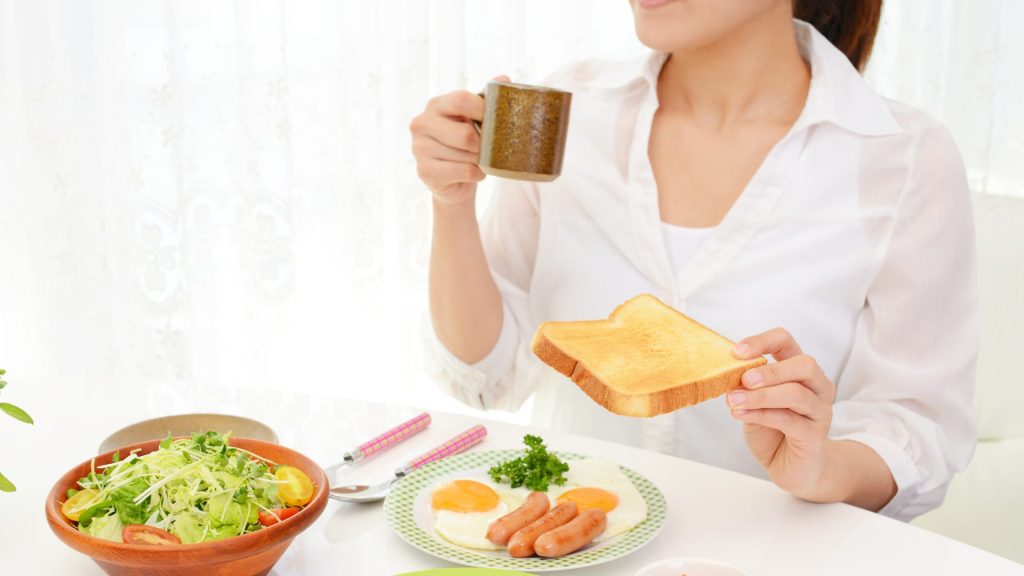 A woman eating breakfast