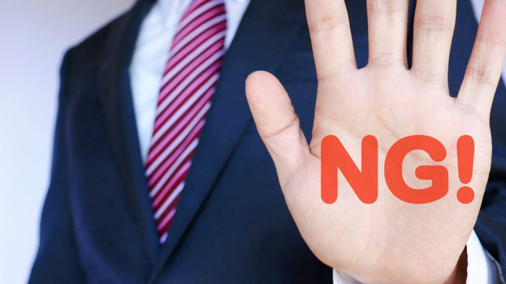 NGサインを出している男性